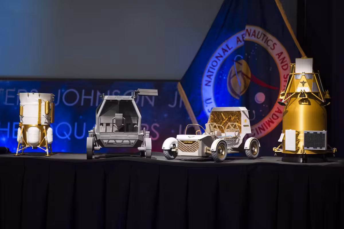 Models of the Blue Origin Mark 1 Lunar Lander, Astrolab Crewed Lunar Rover, Lunar Outpost Pegasus rover, and Firefly Elytra Dark orbiter on display at NASA Headquarters in Washington on May 26, 2026